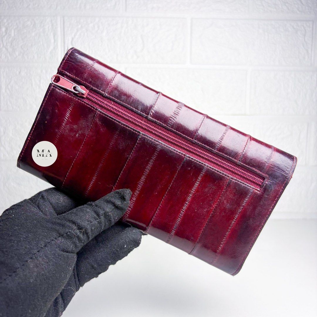 Eel Long Wallet Maroon (Category: Luxury Bags & Wallets) located in Manila. Submitted by maisonavoire (Listing ID 1462890461, Image 2). Description: 𝐄𝐞𝐥 𝐋𝐨𝐧𝐠 𝐌𝐚𝐫𝐨𝐨𝐧 𝐖𝐚𝐥𝐥𝐞𝐭 𝐌𝐚𝐭𝐞𝐫𝐢𝐚𝐥: Genuine Eel Leather featuring a naturally smooth, fine-grained surface with a distinctive soft texture and subtle natural sheen. Eel leather is known for its lightweight, supple feel and elegant appearance, with its fine grain giving the bag