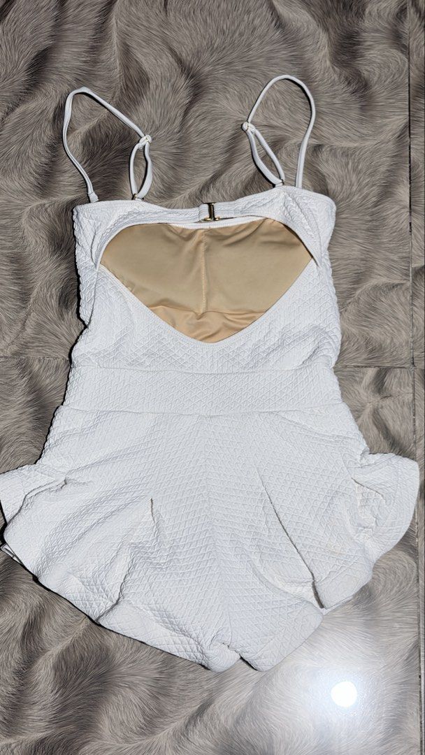 Eight Mermaid One-Piece White Swimsuit Medium (Category: Bikinis & Swimsuits) located in Caloocan City. Submitted by ohhhymyjieee (Listing ID 1463087013, Image 2). Description: Eight Mermaid One-Piece White Swimsuit - White textured one-piece swimsuit - Adjustable straps - Clasp closure at the back - Ruffle detail at leg openings - Minor marks on the back (visible in the last photo) but not noticeable Reason of Selling: gain weight notfit anymore