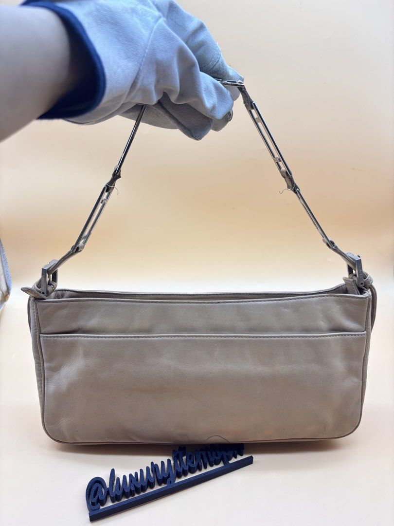 Fendi soft leather Baguette (Category: Luxury Bags & Wallets) located in Pamplona. Submitted by luxuryitems_ph (Listing ID 1462993546, Image 2). Description: - Classic tan leather shoulder bag - Simple and timeless design - Secure zip closure - Adjustable strap with buckle for customized fit - Ideal for everyday use - Minimalist aesthetic.