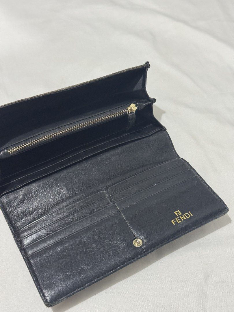 Fendi Zucca Canvas Continental Long Wallet (Category: Luxury Bags & Wallets) located in Manila. Submitted by rzkei (Listing ID 1462943870, Image 2). Description: - Authentic Fendi wallet - Classic Zucca canvas pattern - Black leather interior - Zippered coin pocket - Multiple card slots and bill compartments - Gold tone Fendi logo hardware - Secure snap closure 📍Taguig Price is negotiable..