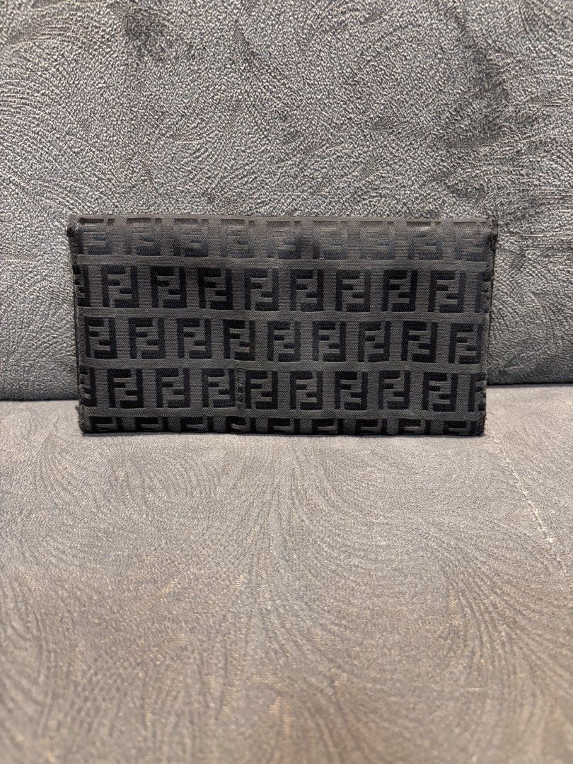 Fendi Zucca Wallet (Category: Luxury Bags & Wallets) located in Mabalacat. Submitted by _limitlessfashion (Listing ID 1462909371, Image 2). Description: - Authentic Fendi wallet - Classic Zucca pattern - Black leather trim - Silver hardware - Made in Italy - Interior shows some signs of wear - Exterior pattern is clear - Snap closure.