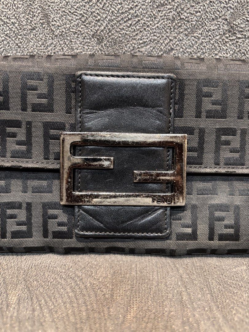 Fendi Zucca Wallet (Category: Luxury Bags & Wallets) located in Mabalacat. Submitted by _limitlessfashion (Listing ID 1462909371, Image 3). Description: - Authentic Fendi wallet - Classic Zucca pattern - Black leather trim - Silver hardware - Made in Italy - Interior shows some signs of wear - Exterior pattern is clear - Snap closure.