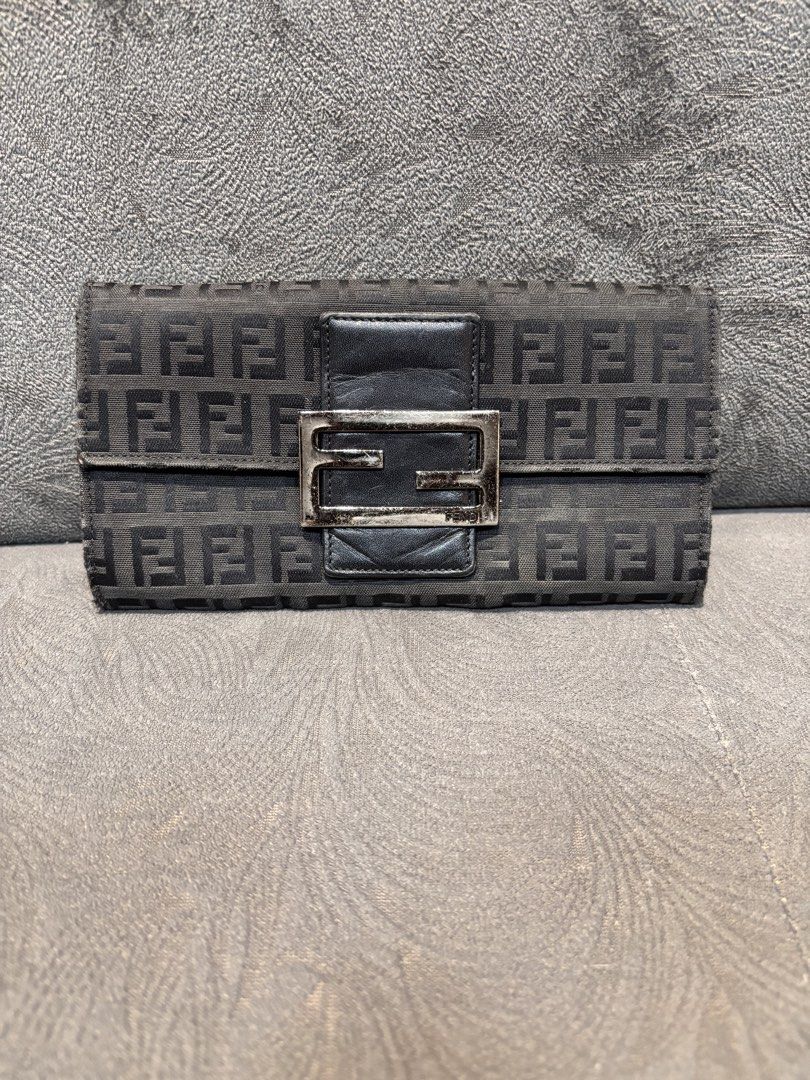 Fendi Zucca Wallet (Category: Luxury Bags & Wallets) located in Mabalacat. Submitted by _limitlessfashion (Listing ID 1462909371, Image 1). Description: - Authentic Fendi wallet - Classic Zucca pattern - Black leather trim - Silver hardware - Made in Italy - Interior shows some signs of wear - Exterior pattern is clear - Snap closure.