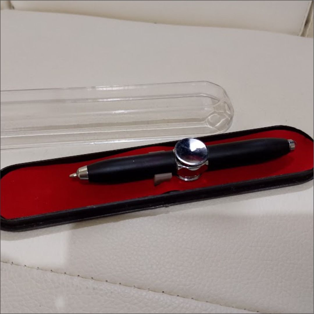 Fidget Pen (Category: Stationery & School Supplies) located in Quezon City. Submitted by susmaryosep1 (Listing ID 1463012292, Image 2). Description: - Fidget Pen Sleek black pen with a stylish silver accent. - Smooth writing experience. - Includes a protective red-lined case and clear plastic cover. - Ideal for personal use or as a thoughtful gift. - Ready for its new owner! 250 .
