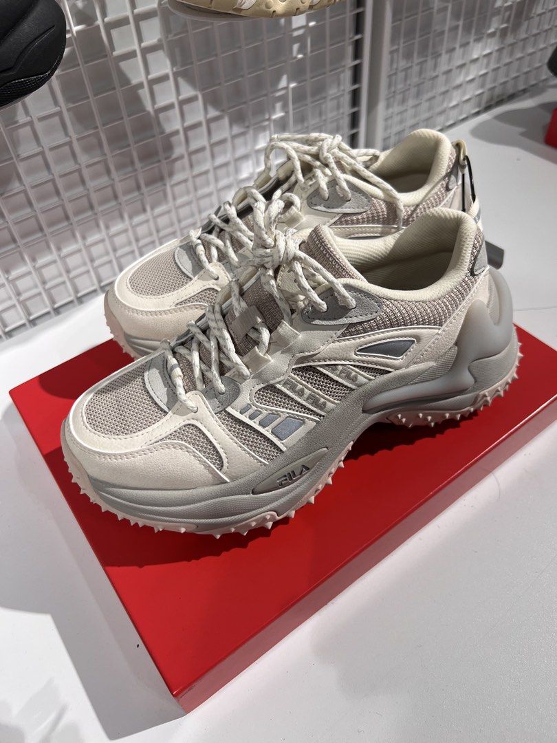 Fila Sneakers - Chunky Sole - Beige/White (Category: Sneakers) located in Manila. Submitted by jpcc74cv9s (Listing ID 1462900803, Image 1). Description: - Brand: Fila - Colorway: Beige and White - Materials: Mesh and Suede details - Laces: White - Design: Modern, chunky sole - Style: Great for casual wear - Features: Unique sole pattern.