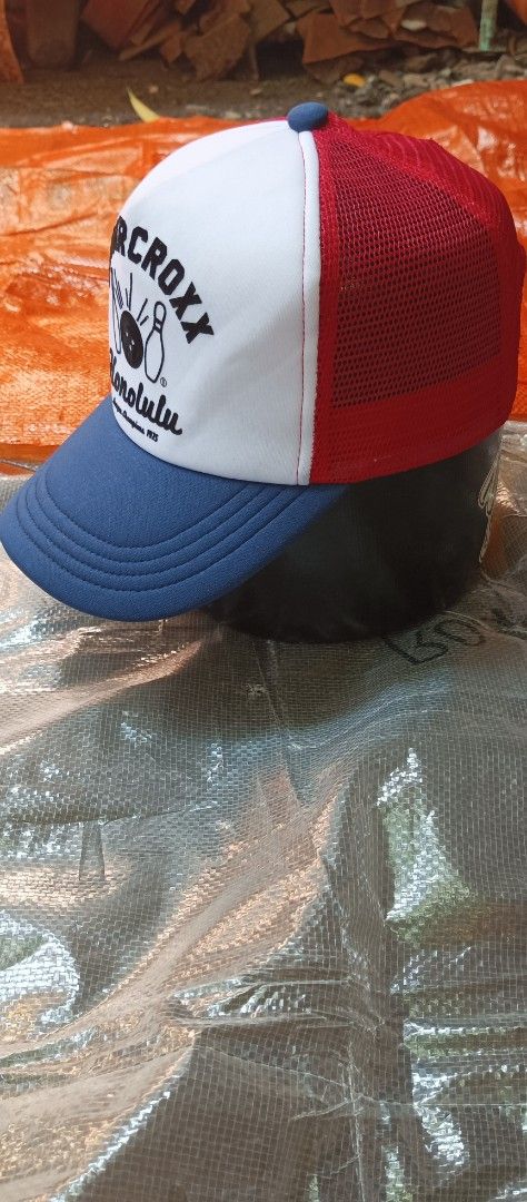 Fingercroxx Trucker Hat SnapBack (Category: Caps & Hats) located in Quezon City. Submitted by mangthrift (Listing ID 1463041476, Image 3). Description: - Brand: Fingercroxx - Design: Honolulu League Champions 1975 - Trucker Hat snap back - Colorway: White front panel, red mesh back, blue brim and front detail - Features: Adjustable snapback closure - Style: Ideal for casual wear - Excellent condition .