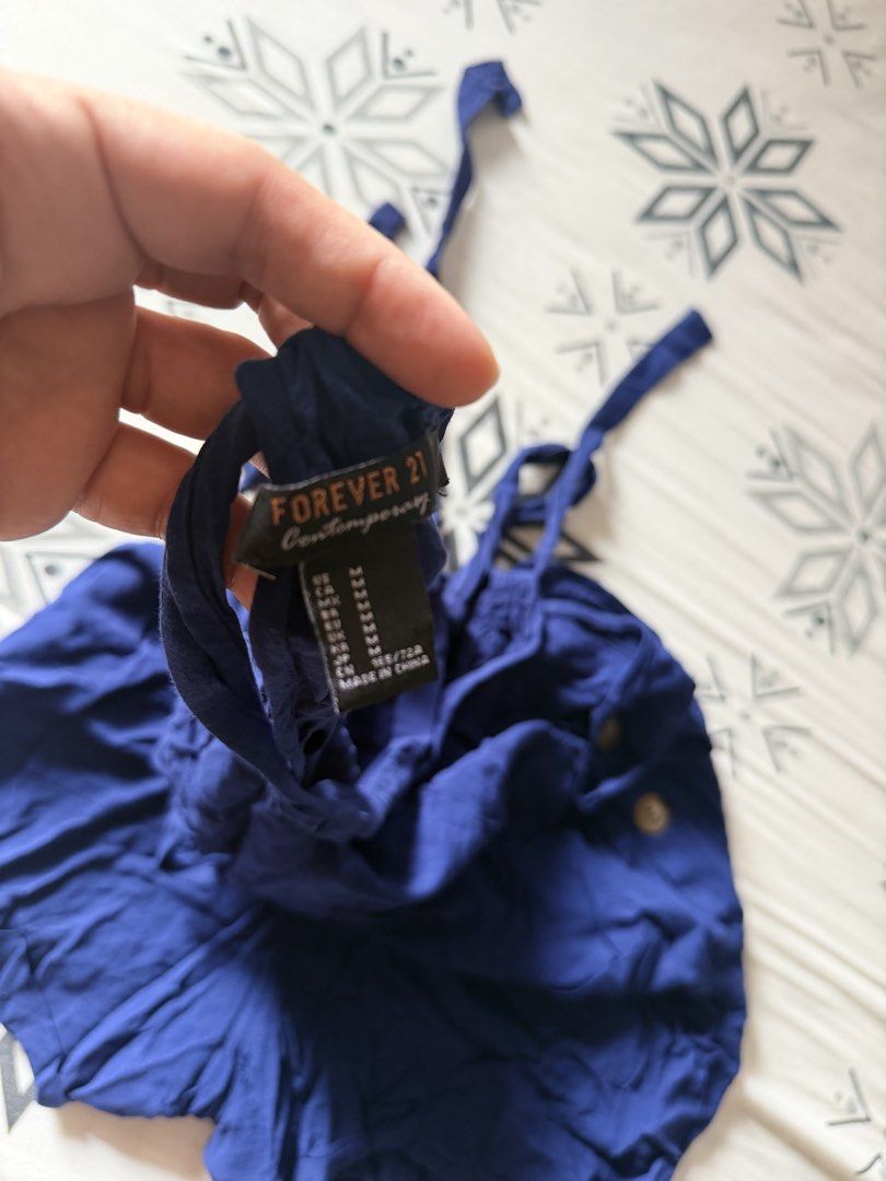 Forever 21 Contemporary Blue Romper Size M (Category: Rompers) located in Marikina City. Submitted by shasundaeclothings (Listing ID 1463033670, Image 3). Description: - Forever 21 Contemporary blue romper - Size: Medium (M) - Adjustable tie straps - Button details on the sides - Elasticated waist with a tie belt - Lightweight fabric - Ideal for casual wear.