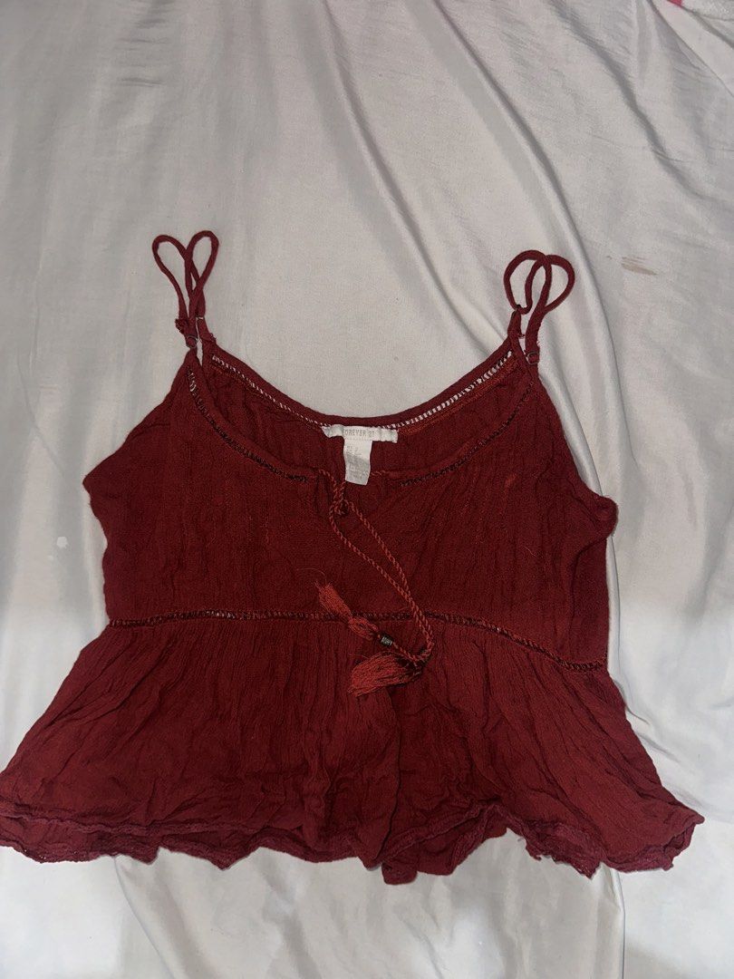 Forever 21 Red Peplum Camisole Top (Category: Sleeveless) located in Manila. Submitted by etain.xo (Listing ID 1463008844, Image 1). Description: - Cute red camisole top from Forever 21 - Flattering peplum hem - Adjustable spaghetti straps - Adorable front tie detail with tassel - Textured crinkled fabric - Ideal for casual wear and everyday styling .