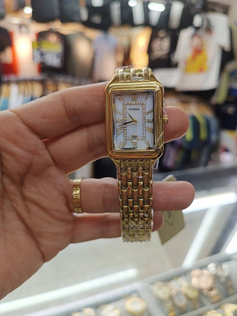 Fossil Rectangular Watch - Gold & Silver Tones (Category: Women's Watches) located in Manila. Submitted by chaionlineshop (Listing ID 1462995412, Image 3). Description: - Elegant Fossil watches - Rectangular face - Gold-toned metal band - Available in all gold or two-toned (gold/silver) - Roman numeral hour markers - Some models feature diamond accents - All watches come with original tags.