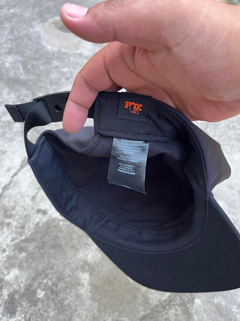 Fox Racing Navy Blue Snapback Cap (Category: Caps & Hats) located in Polomolok. Submitted by paollette1214 (Listing ID 1463042205, Image 2). Description: - Navy blue Fox Racing cap - Features orange embroidered logo on front and back - Adjustable strap for a comfortable fit - Made from a polyester and spandex blend - Ideal for casual wear or sports activities.