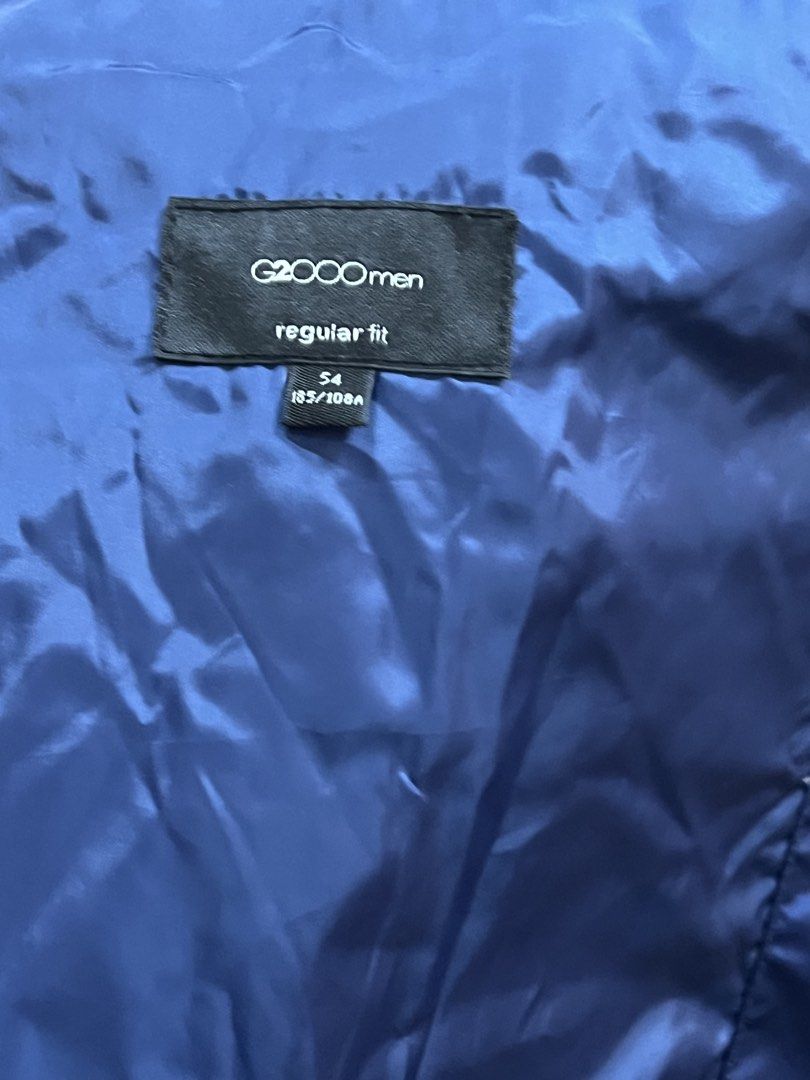 G2000 Men Blue Puffer Jacket with Hood Regular Fit Size 54 (Category: Coats, Jackets and Outerwear) located in Manila. Submitted by cubbyhole525928 (Listing ID 1462925890, Image 3). Description: - G2000 Men's Blue Puffer Jacket - Size: 54 (Regular Fit) - Features a convenient zip-away hood - Two front pockets with secure button closure - Ribbed cuffs and hem for a snug fit - Ideal for staying warm in cooler weather.