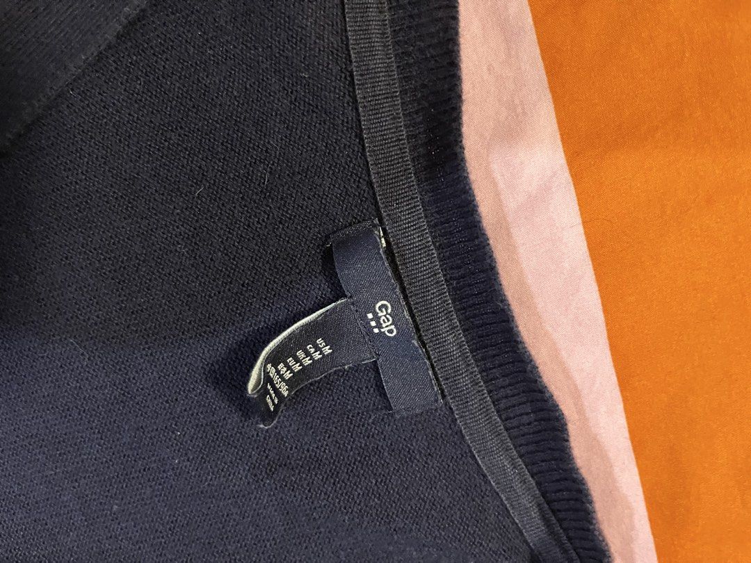 Gap Navy Blue Button Up Cardigan Sweater (Category: Coats, Jackets and Outerwear) located in Mandaluyong City. Submitted by hopeworldplane (Listing ID 1463046219, Image 2). Description: - Navy blue Gap cardigan - Size Medium - Long sleeves - Button-up front - Soft knit material - Classic, simple design - Ideal for layering over tops or dresses.