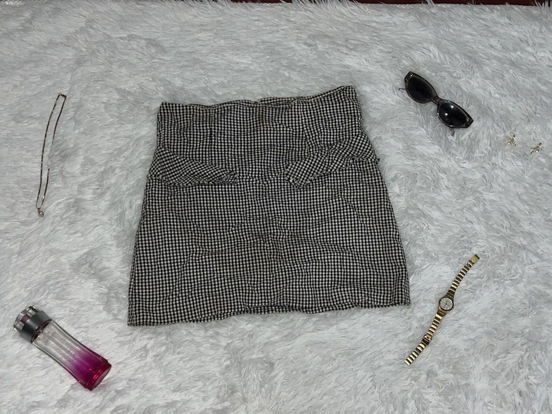 Gingham High-Waisted Ruffle Skirt (Category: Skirts) located in Tuguegarao City. Submitted by love_clothies (Listing ID 1462904288, Image 1). Description: - Adorable black and white gingham pattern - Flattering high-waist design - Charming ruffle detail - Cute tie/bow accent at the front waist - Versatile for casual or dressy outfits - Easy to mix and match with your favorite tops.