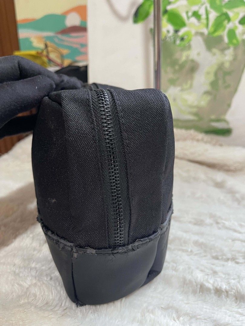 Givenchy Parfums Black Canvas Cosmetic Bag (Category: Purses & Pouches) located in Naawan. Submitted by twilly.apparel2 (Listing ID 1462898070, Image 2). Description: -bakbak Authentic Givenchy Parfums cosmetic bag - Durable black canvas material - Stylish faux leather trim at the bottom - Secure zipper closure with a convenient leather pull tab - Fully lined black fabric interior - Ideal for organizing makeup, toiletries, or travel essentials - 