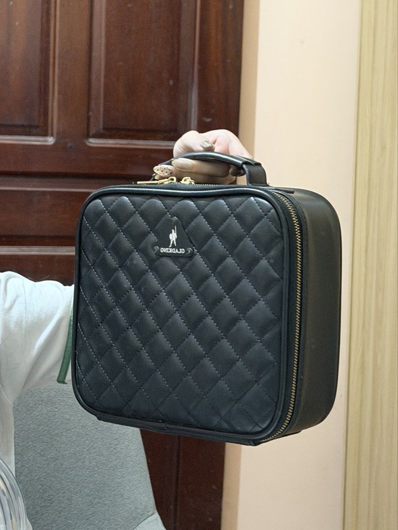 GLADKING Quilted Black Makeup Vanity Case (Category: Makeup) located in Manila. Submitted by margatuazon25 (Listing ID 1463025804, Image 3). Description: - very cutesy makeup bag ✨ - Style: Black quilted makeup case - Features: Handle, zipper closure - Interior: Adjustable dividers for customizable organization - Ideal for: Travel or home use - Benefit: Keeps cosmetics neat and tidy .