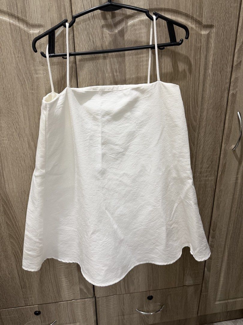 Glamourzy White Linen 2-String Shirt (Category: Dresses) located in Calamba. Submitted by nicalison (Listing ID 1463027618, Image 1). Description: - White mini dress from Glamourzy - Spaghetti straps - Square neckline - Wavy hem detail - Simple and chic design - Versatile for casual outings or dressing up.