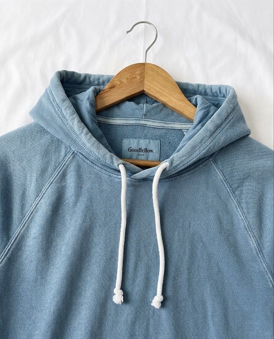 Goodfellow & Co. Blue Pullover Hoodie size M-L (Category: Coats, Jackets and Outerwear) located in Manila. Submitted by goldenprngs101 (Listing ID 1463015424, Image 2). Description: - Brand: Goodfellow & Co. - Color: Light Blue (color may vary due to lighting) - Features: Drawstring hood, raglan sleeves - Material: Soft and comfortable fabric - Style: Classic, casual, great for layering - Pair with: Jeans or shorts -Unisex Hoodie -Condition Note 