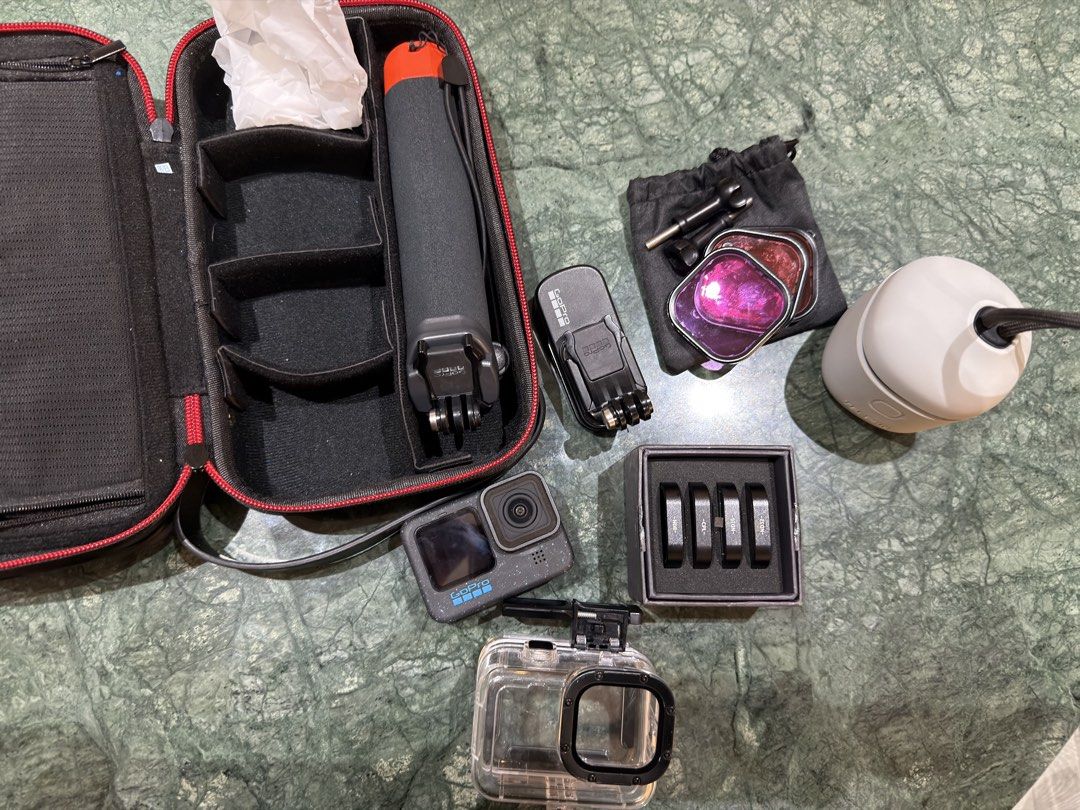 GoPro HERO12 Action Camera with Accessories (Category: Cameras) located in Makati City. Submitted by ayanna08 (Listing ID 1463064614, Image 2). Description: - GoPro HERO12 action camera - Protective waterproof case for diving included - Floating hand grip for water activities/diving - Charger and 1 extra battery - Set of ND/PL filters for enhanced shots - Additional mount for versatility - Case/bag included.