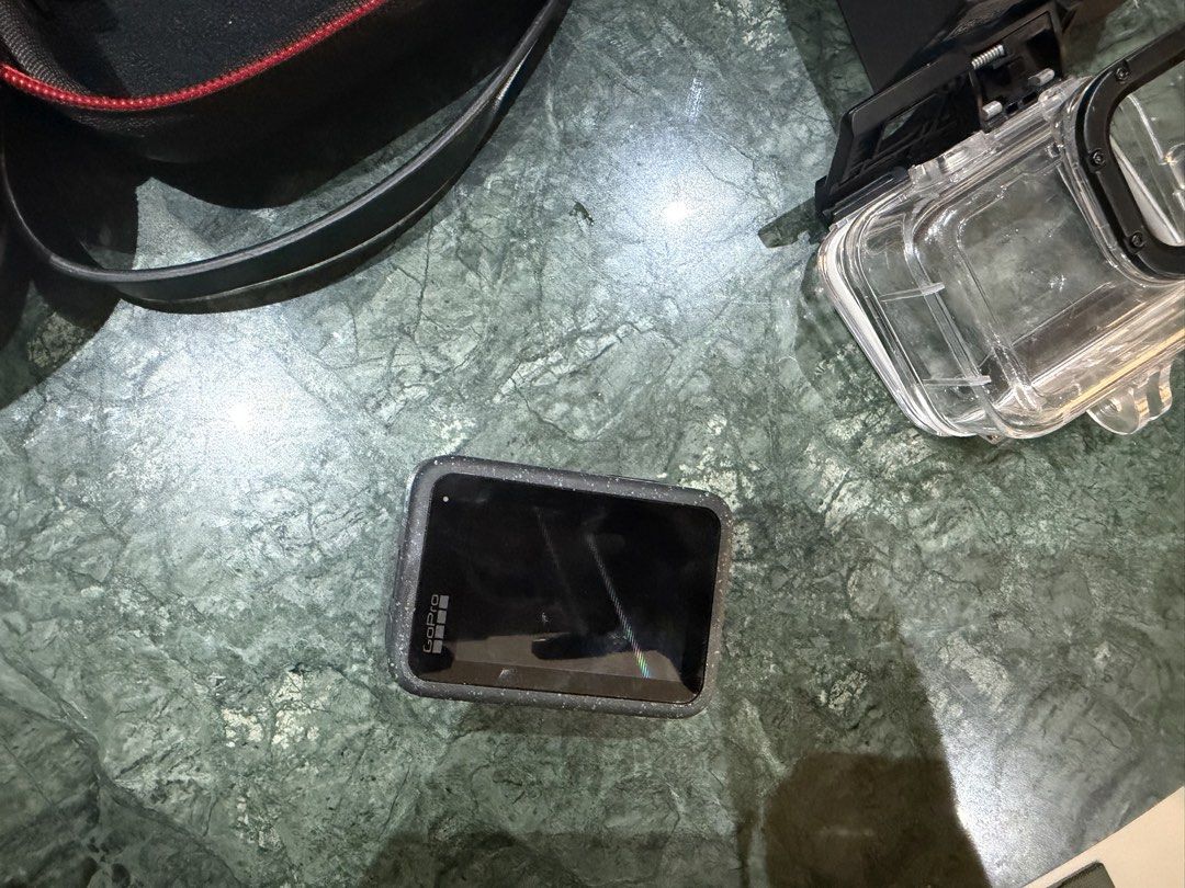 GoPro HERO12 Action Camera with Accessories (Category: Cameras) located in Makati City. Submitted by ayanna08 (Listing ID 1463064614, Image 3). Description: - GoPro HERO12 action camera - Protective waterproof case for diving included - Floating hand grip for water activities/diving - Charger and 1 extra battery - Set of ND/PL filters for enhanced shots - Additional mount for versatility - Case/bag included.