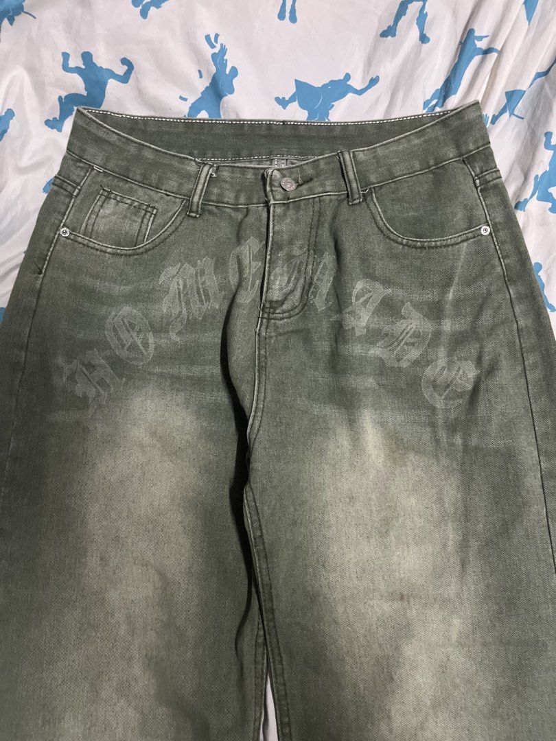 Green Washed y2k baggy pants (Category: Jeans) located in Manila. Submitted by lokeh (Listing ID 1463040237, Image 3). Description: - Green washed denim jeans - Features a gothic-style print on front and back - Relaxed fit, wide leg - Ideal for streetwear outfits - Please check photos for detailed print views.