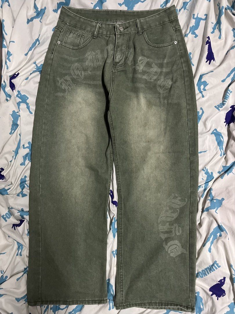 Green Washed y2k baggy pants (Category: Jeans) located in Manila. Submitted by lokeh (Listing ID 1463040237, Image 1). Description: - Green washed denim jeans - Features a gothic-style print on front and back - Relaxed fit, wide leg - Ideal for streetwear outfits - Please check photos for detailed print views.