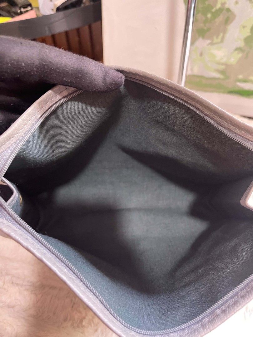 Grey Leather pouch Bag (Category: Clutches) located in Naawan. Submitted by twilly.apparel2 (Listing ID 1462913124, Image 3). Description: - issue have color transfer Classic grey leather clutch - Simple and elegant design - Secure zipper closure - Fully lined interior - Approximately 9 inches wide - Ideal for everyday use or travel - Fits all your essentials.