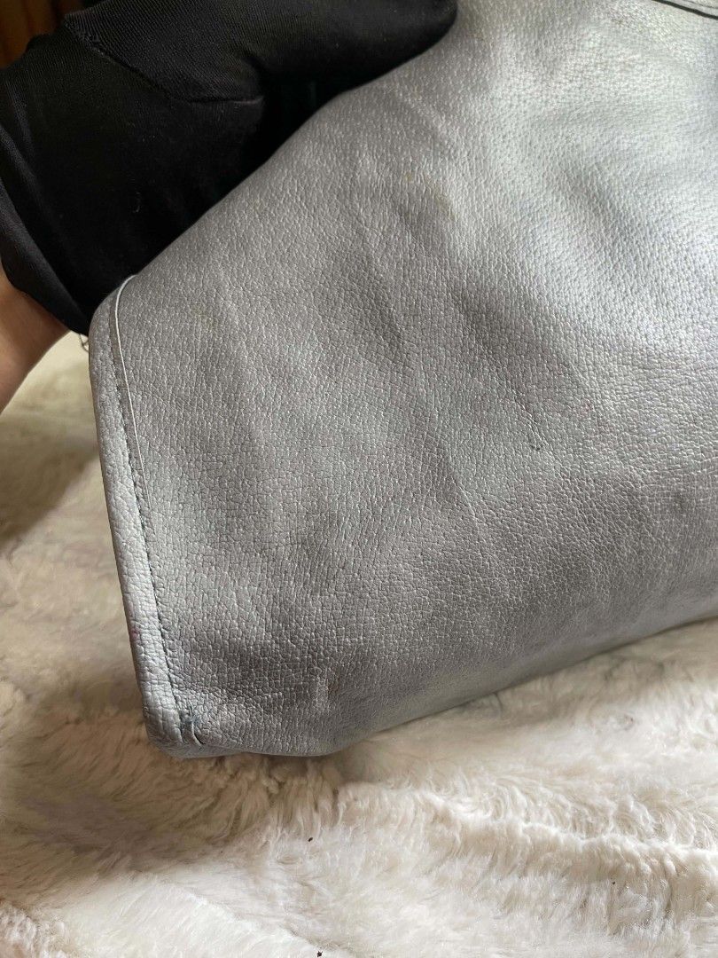 Grey Leather pouch Bag (Category: Clutches) located in Naawan. Submitted by twilly.apparel2 (Listing ID 1462913124, Image 2). Description: - issue have color transfer Classic grey leather clutch - Simple and elegant design - Secure zipper closure - Fully lined interior - Approximately 9 inches wide - Ideal for everyday use or travel - Fits all your essentials.