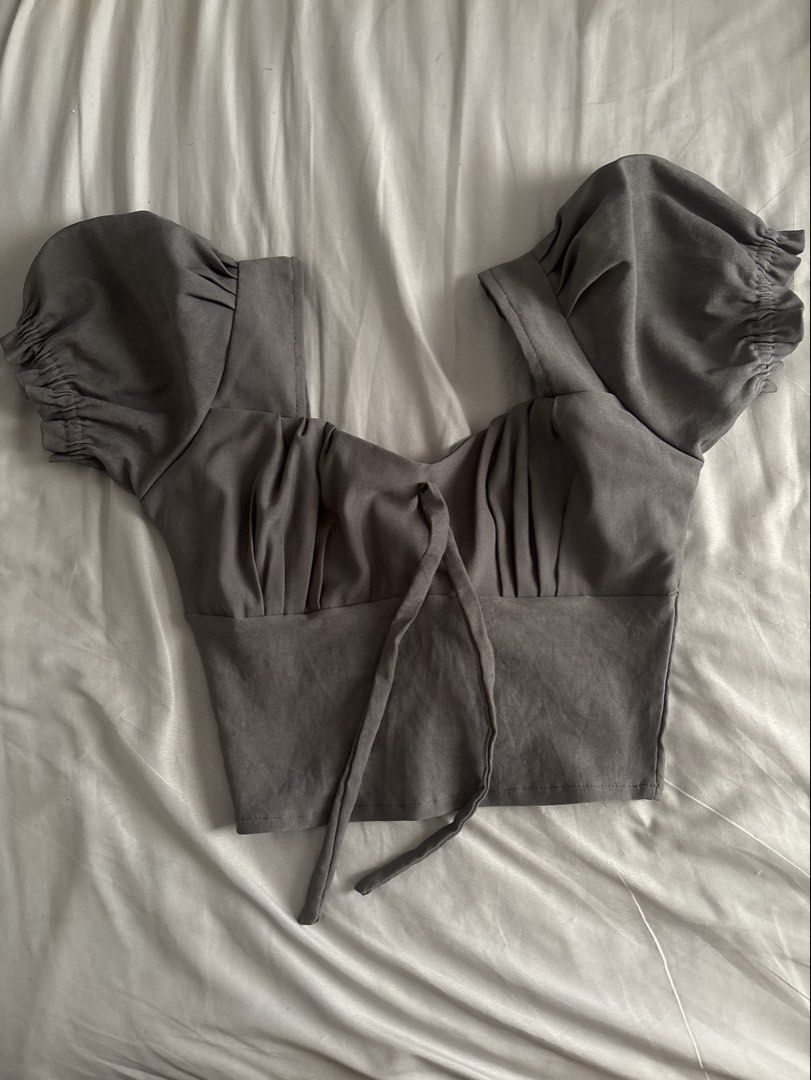 ZARA Grey Puff Sleeve Tie Front Crop Top (Category: Blouses) located in Manila. Submitted by shihtzuluvr (Listing ID 1462919630, Image 1). Description: - Grey crop top - Puff sleeves with elasticated cuffs - Sweetheart neckline - Tie front detail - Estimated size S/M - Versatile for casual or night out looks RFS: decluttering MOP: gcash / maya / bank transfer MOD: lalamove / lbc.