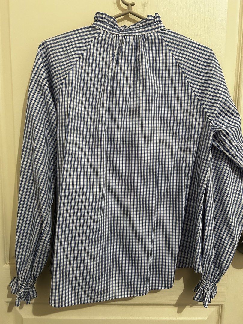 GU Gingham Ruffle Neck Long Sleeve Blouse (Category: Blouses) located in Roxas City. Submitted by preloved_by_workingstudent (Listing ID 1462901449, Image 3). Description: - Very nice fabric - Blue and white gingham blouse from GU - Features a cute ruffled high neck - Ruffled cuffs and button-up front - Long sleeves with a slight puff - Can be tucked in or worn loose - Easy to style for casual or dressy occasions.
