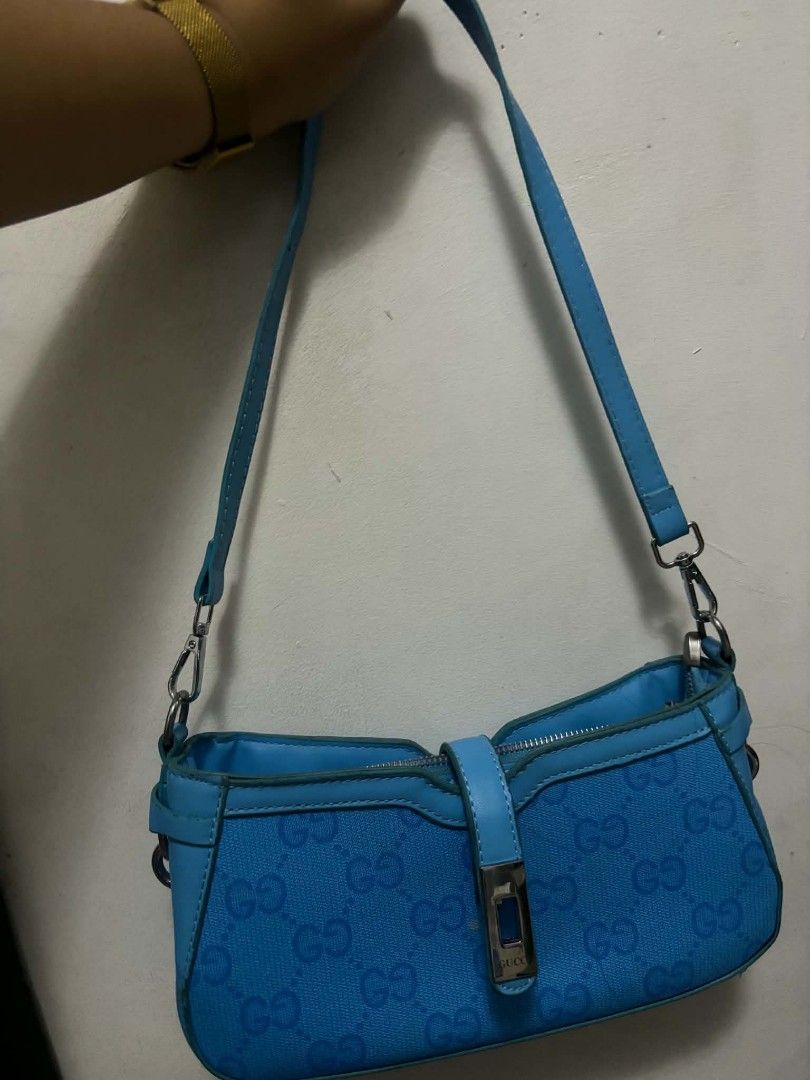 Gucci Blue GG Monogram Shoulder Bag (Category: Luxury Bags & Wallets) located in Carmona. Submitted by myraprrzz (Listing ID 1462994237, Image 2). Description: - Authentic Gucci shoulder bag - Vibrant blue color - Iconic GG monogram pattern - Includes original box - Includes dust bag - Includes authenticity card - Includes strap - Versatile for everyday use or nights out.