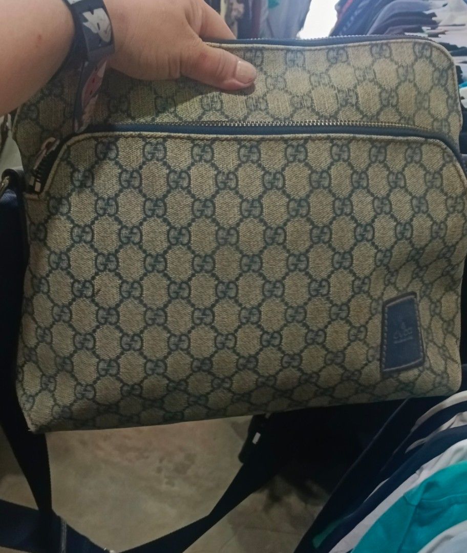 Gucci Crossbody Bag (Category: Luxury Bags & Wallets) located in Legazpi City. Submitted by georgepineda791 (Listing ID 1462996523, Image 1). Description: ✨ PRELOVED GUCCI UNISEX CROSSBODY BAG ✨ A practical and spacious Gucci crossbody bag that can be worn by both men and women. Perfect for everyday use with its roomy interior and comfortable canvas strap. 🖤 👜 DETAILS: • Gucci crossbody bag • Unisex design • PVC leather exterior with canvas str