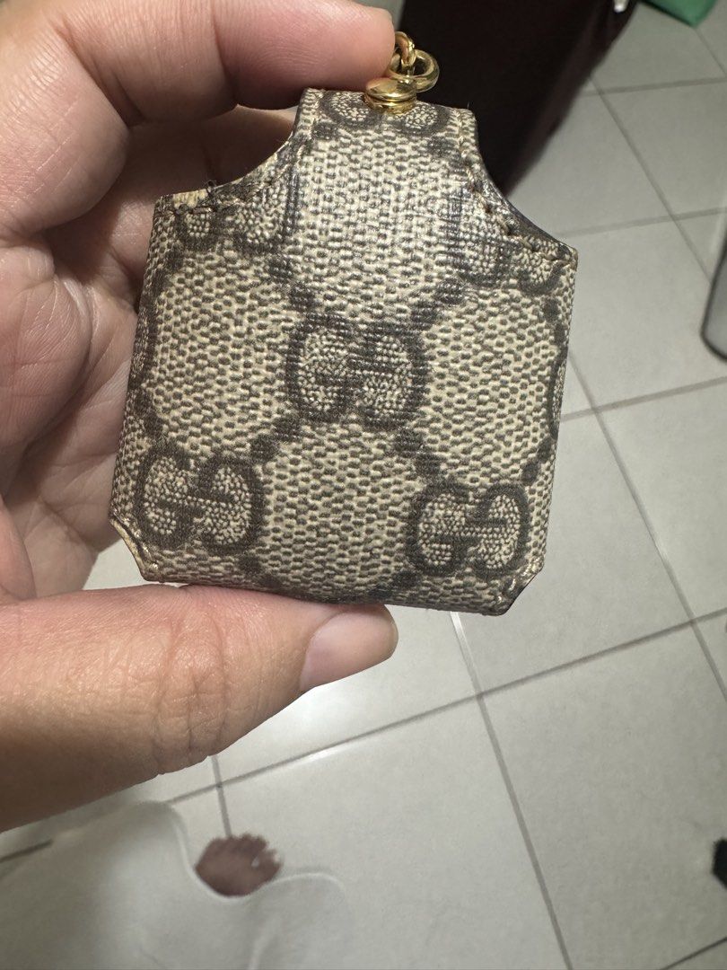 Gucci GG Monogram Pouch Keychain Holder (Category: Luxury Bags & Wallets) located in Marilao. Submitted by cj458678 (Listing ID 1463043099, Image 3). Description: - Authentic Gucci pouch - Classic GG monogram print in brown and beige - Secure snap button closure - Signature metal GG logo detail - Small loop for attaching to keys or bag - Ideal for small essentials like coins or earbuds Purchase for 19,800 Apple Airpods ver.1 .