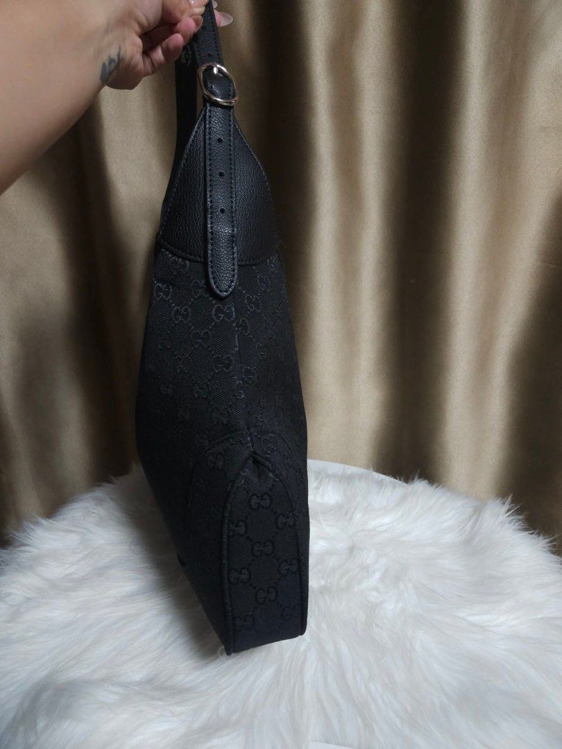 Gucci Jackie Hobo Large (Category: Luxury Bags & Wallets) located in Pasay City. Submitted by 2ndloveforever2023 (Listing ID 1462900712, Image 2). Description: - Gucci Hobo Bag - Japan Sourced (NGA) - Color: Black GG Canvas with Leather Trim - Hardware: Silver detail on front closure - Strap: Single shoulder strap - Origin: Made in Italy - Ideal for: Great everyday bag.