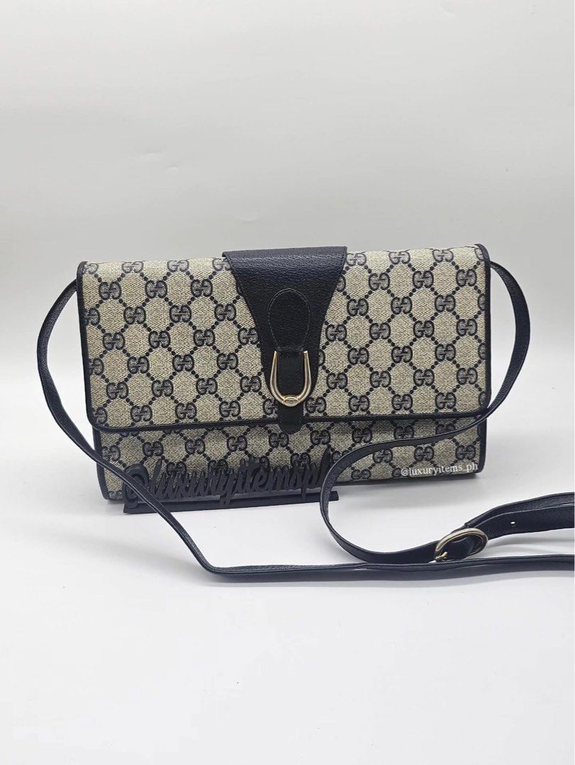 Gucci Monogram Shoulder Bag (Category: Luxury Bags & Wallets) located in Pamplona. Submitted by luxuryitems_ph (Listing ID 1462996251, Image 1). Description: - Vintage Gucci shoulder bag - Classic GG monogram canvas - Black leather trim - Secure flap closure with gold-tone buckle - Adjustable leather strap - Timeless piece - Approx. dimensions: 9" x 6" x 2".