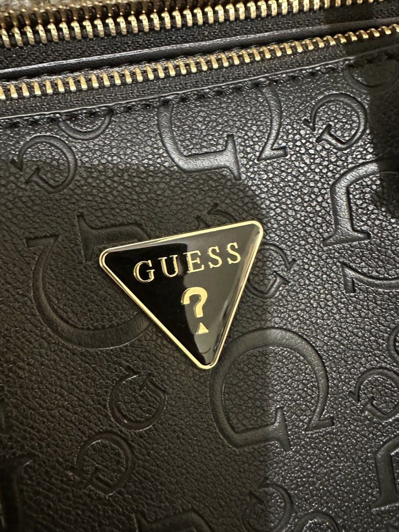 Guess black bag (Category: Purses & Pouches) located in Taguig. Submitted by honeyy19 (Listing ID 1462911392, Image 3). Description: Used once. Brand name still covered in plastic. Pristine condition! RFS - too many bags, hindi nagagamit. Sayang! .