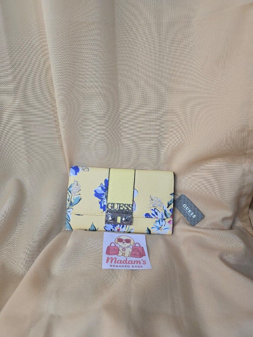 Guess Yellow Floral Long Wallet (Category: Wallets & Card holders) located in Pasay City. Submitted by allysawnnn (Listing ID 1463030414, Image 2). Description: brand new bought from US Long wallet 19 card slots.
