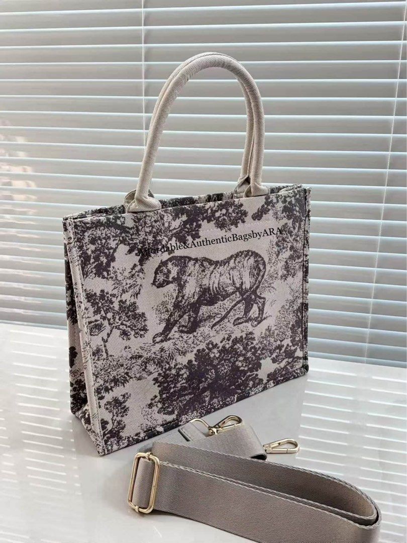 GWP DIOR TIGER PRINT BOOK TOTE BAG (Category: Tote Bags) located in Daet. Submitted by ecassenluxuries (Listing ID 1462939002, Image 2). Description: 📍 PRE-ORDER ITEM ▫️Authentic GWP Modified Christian Dior Book tote bag ▫️Iconic tiger print design ▫️Durable canvas material with leather trim ▫️Detachable shoulder strap included ▫️Spacious interior with a small pocket ▫️Ideal for everyday use or travel ✅ All items are guaranteed 💯% AUTHENTIC ✅ N