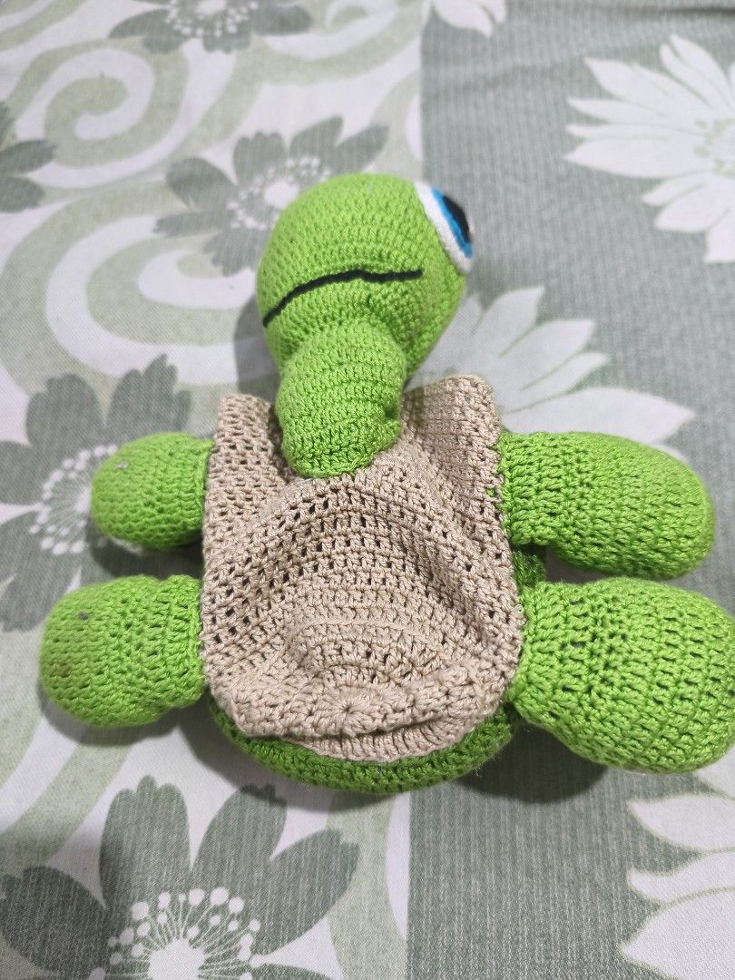 Handmade Crocheted Turtle Holder for Cups or Glasses (Category: Handmade Craft) located in Bulacan. Submitted by jvblaguard08460 (Listing ID 1463009937, Image 3). Description: - Adorable green crocheted turtle - Features a vibrant shell with colorful circle patterns - Can hold cups or glasses, making it a functional accessory - Ideal for desk decoration - Unique and handmade gift idea.
