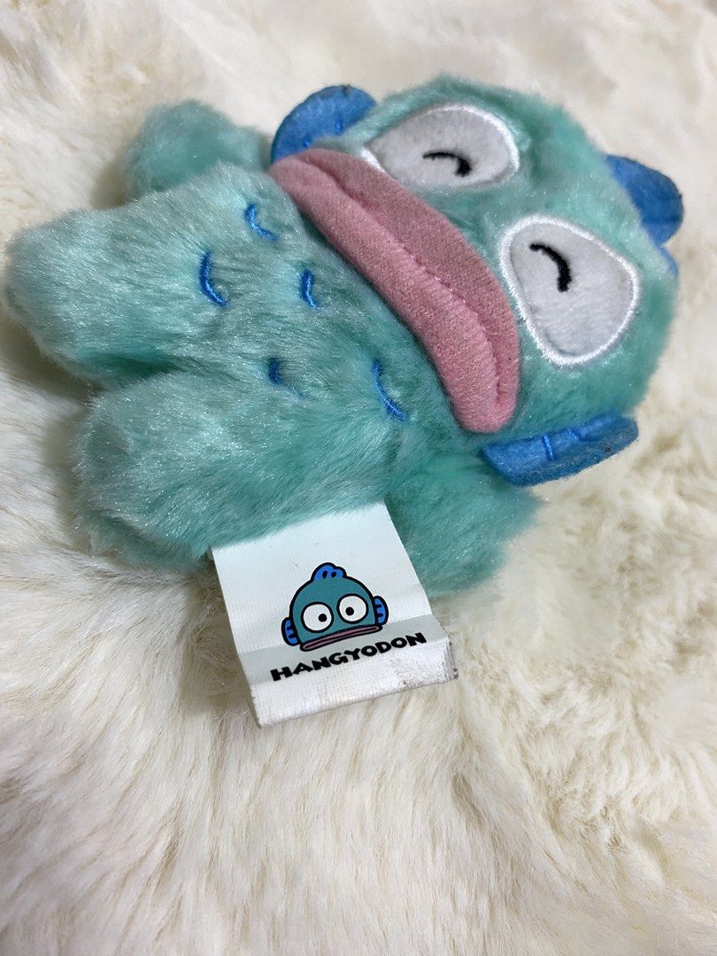 Hangyodon Plush Toy Keychain (Category: Plushies & Soft Toys) located in Kalibo. Submitted by ollie_stuffshop (Listing ID 1463079318, Image 3). Description: Before you send your inquiries: ❗️Last Price is already posted ❗️Manage your expectations, WYSIWYG ❗️May need washing ❗️Dropoff is every Wednesday & Sunday - Adorable Hangyodon plush toy - Features a convenient keychain attachment - Eye-catching teal blue color with a cute pink tongue detail 