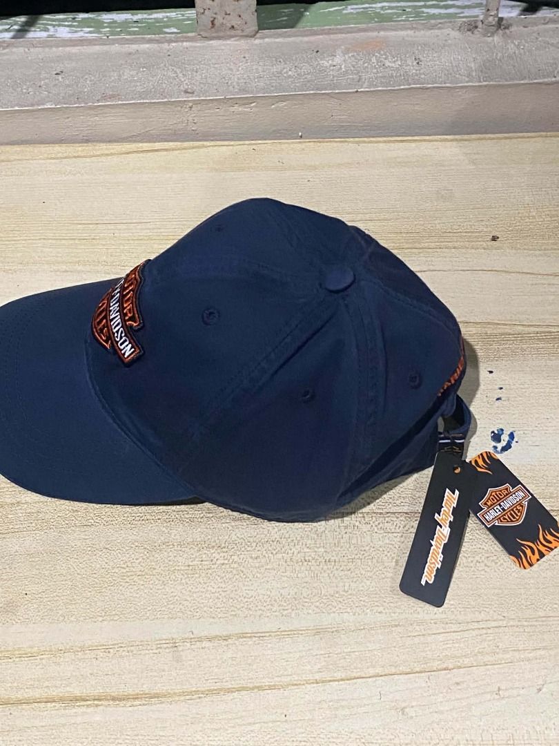 Harley Davidson Bar & Shield Motorcycle Cap with tags and sticker (Category: Caps & Hats) located in Quezon City. Submitted by carlos132 (Listing ID 1463070986, Image 2). Description: - Navy blue baseball cap - Classic Harley-Davidson logo on front - "Harley-Davidson" embroidered on back - Adjustable strap for a comfortable fit - Perfect for Harley-Davidson fans - Comes with original tags.