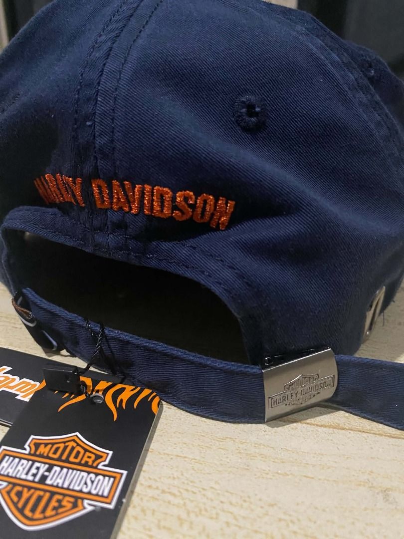 Harley Davidson Bar & Shield Motorcycle Cap with tags and sticker (Category: Caps & Hats) located in Quezon City. Submitted by carlos132 (Listing ID 1463070986, Image 3). Description: - Navy blue baseball cap - Classic Harley-Davidson logo on front - "Harley-Davidson" embroidered on back - Adjustable strap for a comfortable fit - Perfect for Harley-Davidson fans - Comes with original tags.