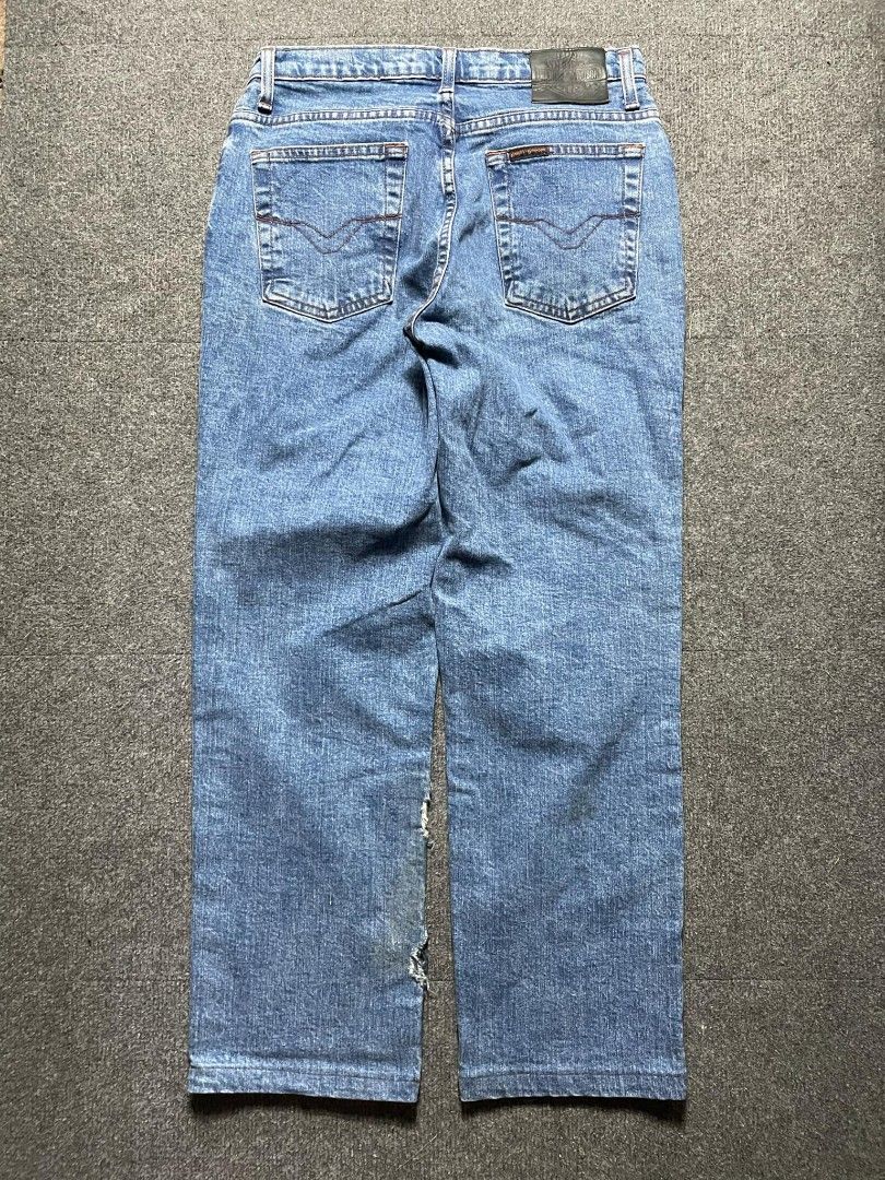 Harley-Davidson Blue Denim Jeans (Category: Activewear) located in Ligao. Submitted by merjudioma64633 (Listing ID 1463009253, Image 2). Description: - Harley-Davidson blue wash denim jeans - Classic straight leg fit - Iconic Harley-Davidson logo patch on back waistband - Minor wear and tear visible on leg areas - Perfect for everyday wear.