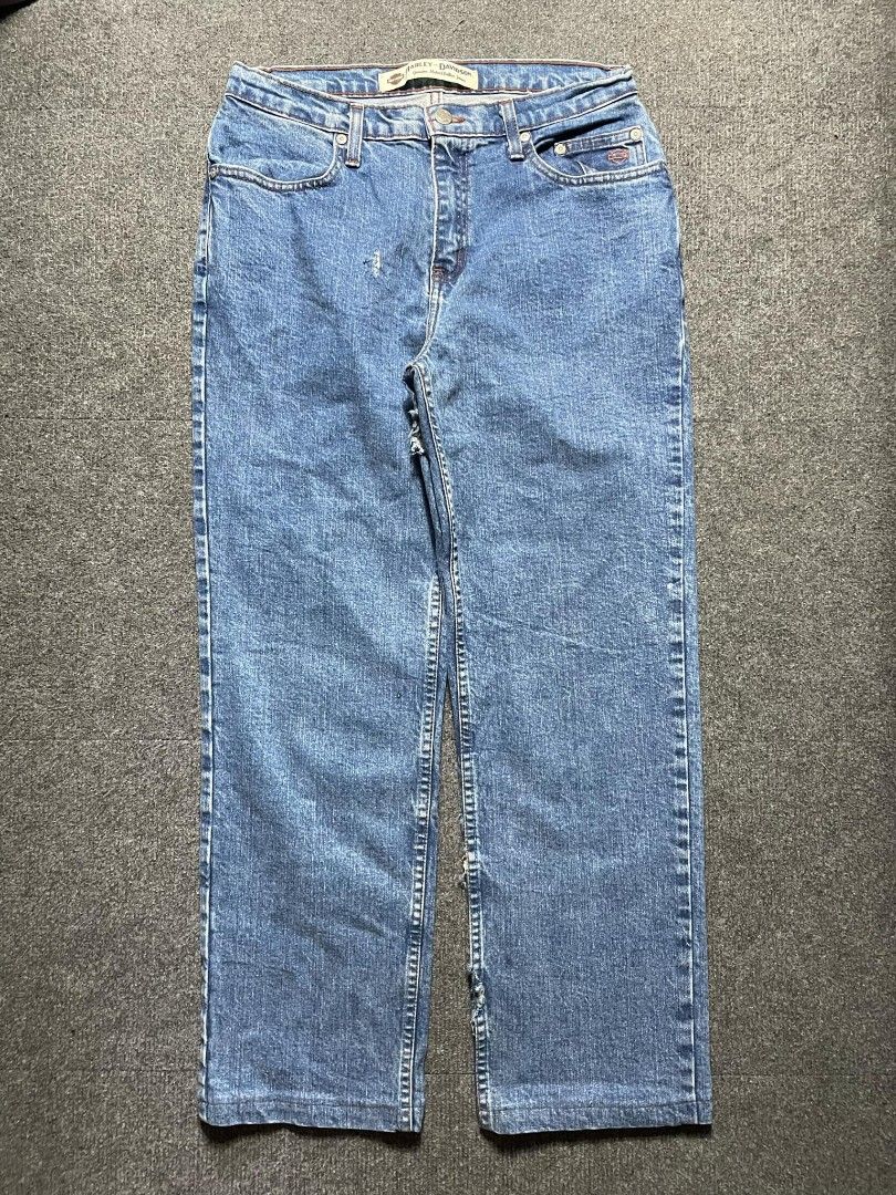 Harley-Davidson Blue Denim Jeans (Category: Activewear) located in Ligao. Submitted by merjudioma64633 (Listing ID 1463009253, Image 1). Description: - Harley-Davidson blue wash denim jeans - Classic straight leg fit - Iconic Harley-Davidson logo patch on back waistband - Minor wear and tear visible on leg areas - Perfect for everyday wear.