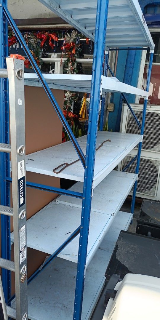 Heavy Duty Metal Shelving Unit Components (Category: Shelves, Cabinets & Racks) located in Paranaque City. Submitted by materesadimasaca (Listing ID 1462888297, Image 3). Description: - Heavy-duty metal shelving components - Includes upright beams and shelf panels - Color: Light blue/grey - Ideal for warehouse, garage, or workshop storage - Stackable design for convenient transport - Multiple units available.