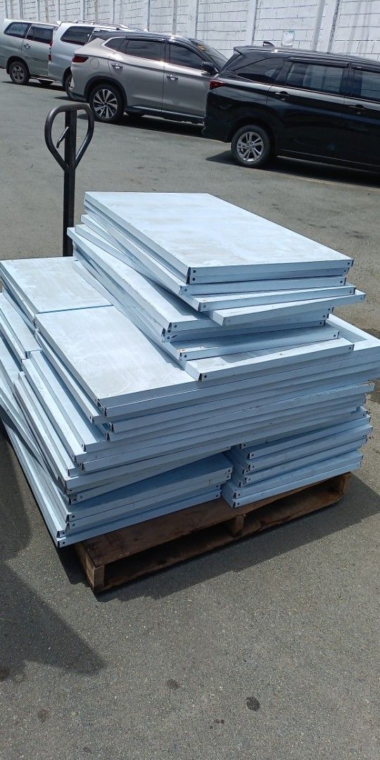 Heavy Duty Metal Shelving Unit Components (Category: Shelves, Cabinets & Racks) located in Paranaque City. Submitted by materesadimasaca (Listing ID 1462888297, Image 1). Description: - Heavy-duty metal shelving components - Includes upright beams and shelf panels - Color: Light blue/grey - Ideal for warehouse, garage, or workshop storage - Stackable design for convenient transport - Multiple units available.