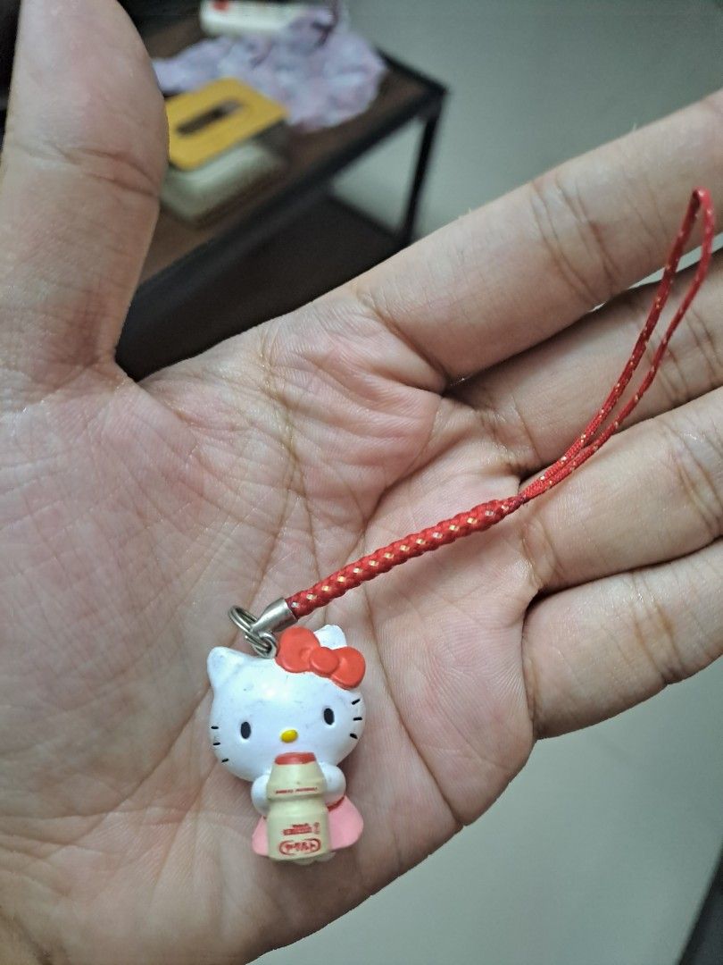 Hello Kitty charm with milk bottle, red string (Category: Character Goods) located in Manila. Submitted by secreshop (Listing ID 1462906988, Image 1). Description: - Adorable Kitty charm - Features Kitty holding a milk bottle - Includes a red braided string - Ideal for decorating phones or bags - Small and lightweight accessory - Adds a fun touch to your belongings price is negotiable slight.
