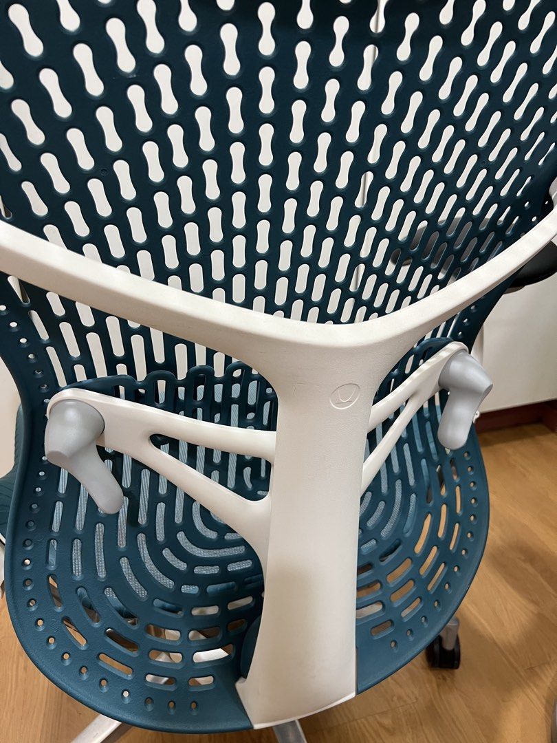 Herman Miller Mirra 2 (Category: Office Furniture & Fixtures) located in Manila. Submitted by darrensyy (Listing ID 1463092575, Image 2). Description: - Ergonomic office chair in a stylish teal color. - Breathable mesh back and seat for maximum comfort. - Adjustable armrests for personalized support. - Smooth-rolling casters for effortless mobility. - Ideal for extended work sessions. - Shows minor signs of use on the seat mesh. - Overall in good