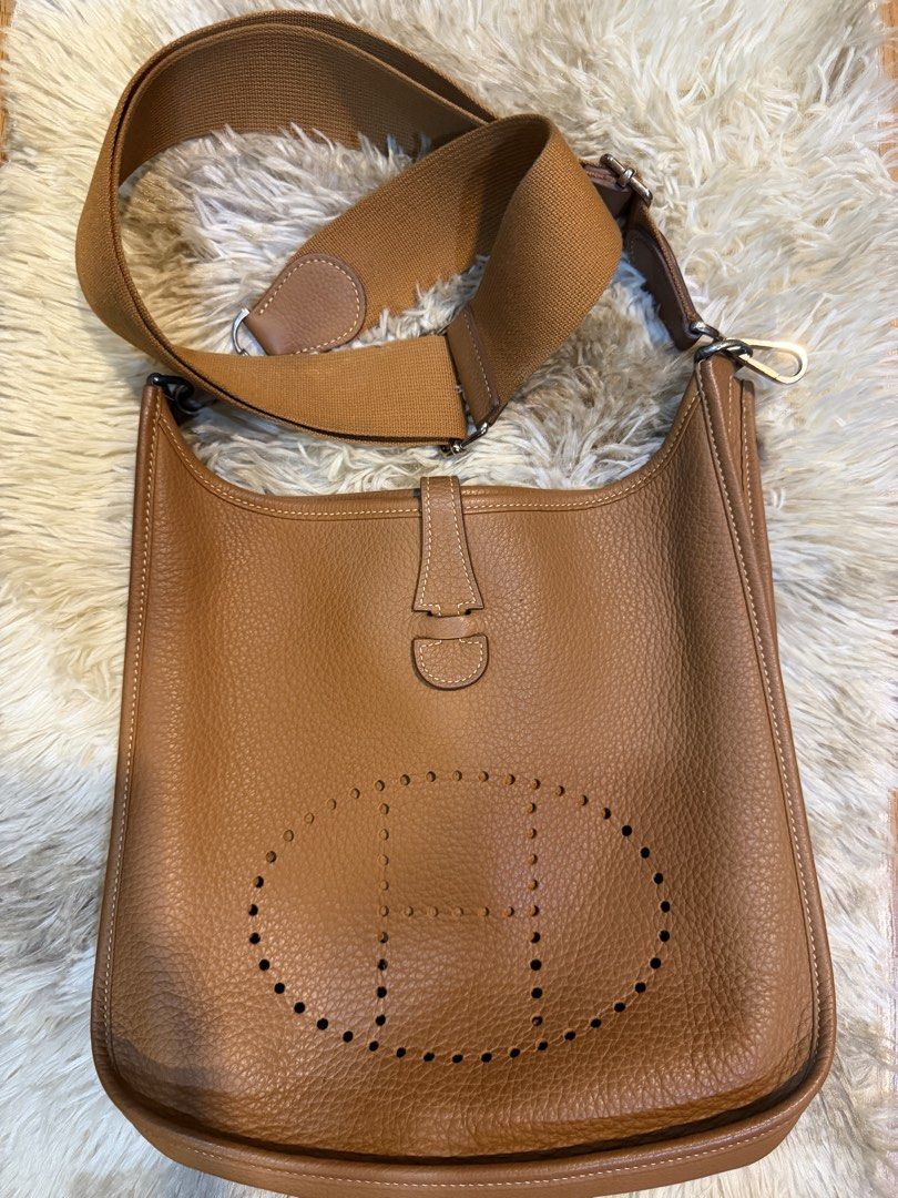 Hermes Evelyne PM Shoulder Bag Brown Leather (Category: Luxury Bags & Wallets) located in Manila. Submitted by hairaen (Listing ID 1463005153, Image 1). Description: - Authentic Hermes Evelyne bag - TPM size - Classic brown leather - Iconic perforated H logo on front - Adjustable canvas strap for crossbody/shoulder wear - Clean interior - Ideal everyday bag.
