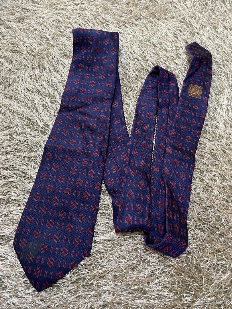 Hermes Paris Silk Tie Navy Red Pattern (Category: Ties) located in Bulacan. Submitted by rich2545 (Listing ID 1462906877, Image 1). Description: - Authentic Hermes Paris Tie - 100% Silk - Classic Red 'H' Pattern on Navy Blue - Made in France - Elevates any outfit.