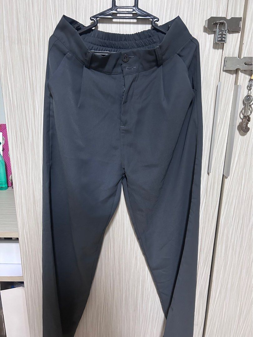 High Waisted Wide Leg Trousers Grey (Category: Other Bottoms) located in Manila. Submitted by juvy13 (Listing ID 1463016618, Image 1). Description: - Grey wide leg trousers - High-waisted fit - Button and zip closure - Elasticated back waistband for comfort - Pleated front detail - Perfect for dressing up or down - Ideal for work or casual occasions.